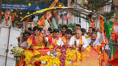 BJP National President Nitin nabin along with Madhya Pradesh Chief Minister Mohan Yadav, state party President Hemant Khandelwal, state Cabinet Minister Kailash Vijayvargiya and others greet the gathering during a rally on Nabin's first visit to Indore after taking charge of the party, Thursday, Sept. 17, 2026.