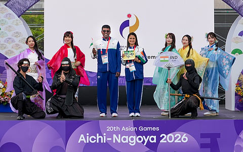 Former Asian Games medallist and shooter Anjali Bhagwat (Centre r) and former athlete Lijo David (centre R) during the official during the flag hoisting ceremony on Friday