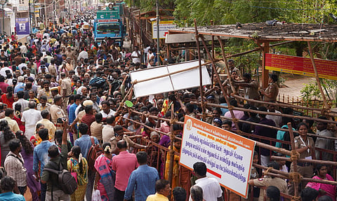 Devotees thronging the Meenakshi temple’s western entrance for darshan during the maha kumbabishekam on Thursday 