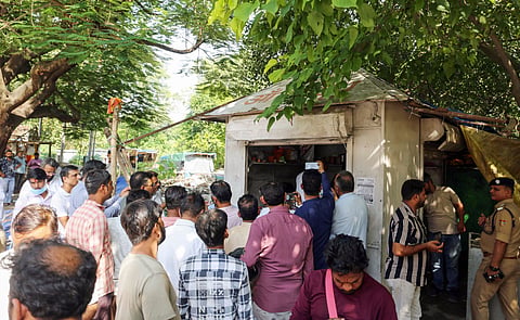  People gather as police inspect the site after Surendra Koli, accused in the Nithari case found dead in a tea stall opposite the Lal Mata Temple, in Haridwar on Friday.