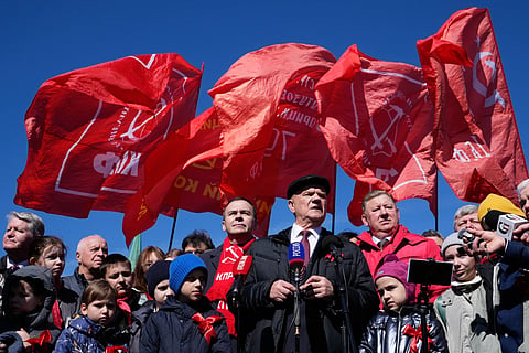 Russian Communist Party leader Gennady Zyuganov, center, speaks to journalists after laying flowers at the mausoleum of USSR founder Vladimir Lenin in Red Square, in Moscow, marking the 156th anniversary of his birth on Wednesday, April 22, 2026. 
