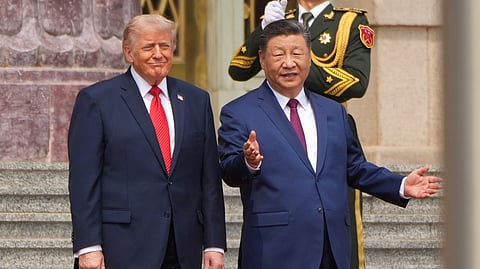 US President Donald Trump, left, participates in a welcome ceremony with China's President Xi Jinping at the Great Hall of the People, May 14, 2026, in Beijing. 
