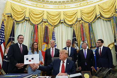 President Donald Trump speaks as South Dakota Gov. Larry Rhoden, from left, Arkansas Gov. Sarah Huckabee Sanders, Mehmet Oz, administrator of the Centers for Medicare & Medicaid Services, Health and Human Services Secretary Robert F. Kennedy Jr., Mississippi Gov. 