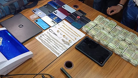 Cash and other items seized from the three accused siblings 
