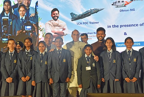 Defence Minister Rajnath Singh, Civil Aviation Minister K Rammohan Naidu and students during the handover ceremony in Bengaluru on Friday