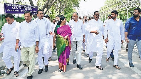 Congress MPs and MLAs leave the Assembly as they head to Siddipet to inspect land allegedly registered in BRS leader T Harish Rao’s name on Rajiv Road along the Ranganayakasagar reservoir.