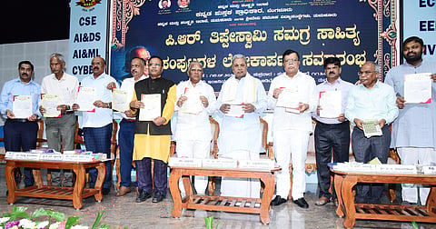 Former CM Siddaramaiah and former minister K N Rajanna at the launch noted artist P R Thippeswamys comprehensive book of his literary works in Tumakuru on Friday. 