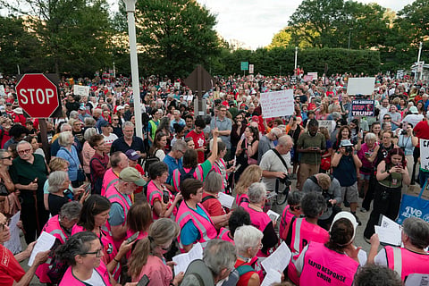 People rally against the closing of the John F. Kennedy Center for the Performing Arts on Friday, Sept. 18, 2026, in Washington. 