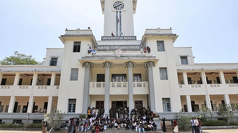 KSU activists climb atop the Kerala University headquarters in Thiruvananthapuram on Friday during a protest alleging that SFI activists tampered with nomination papers for the university union election.
