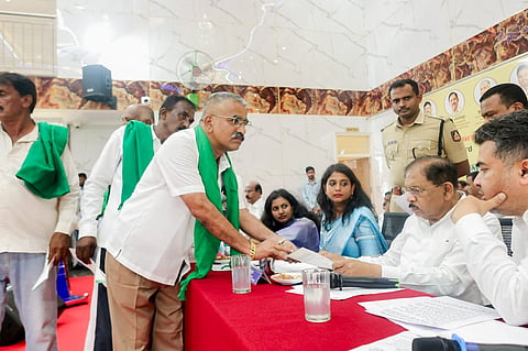 Deputy Chief Minister Dr G. Parameshwara receives grievances from people during a Praja Seva programme in Kunigal on Saturday.