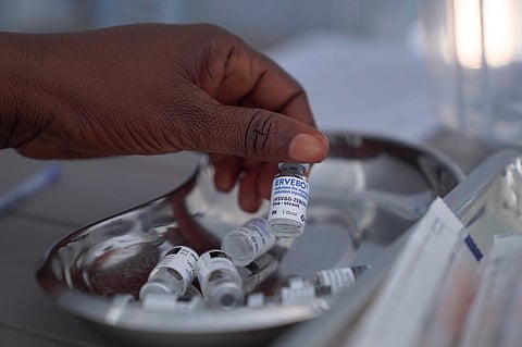 A healthcare worker holds up a vial of the Ervebo vaccine at an Ebola vaccination center in the city of Bunia, Ituri province, Congo, Saturday, Sept. 19, 2026.