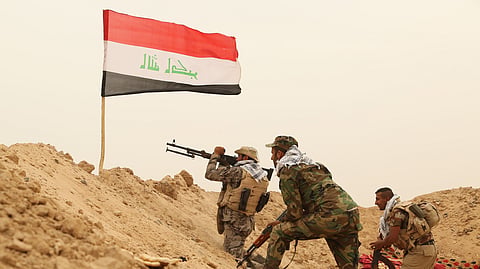 Fighters from the Badr Brigades Shiite militia clash with an Islamic State militant group at the front line on the outskirts of Fallujah in the Anbar province of Iraq, June 1, 2015.