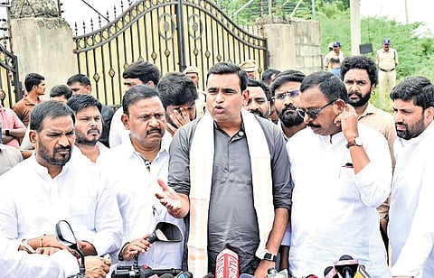 Congress MP Chamala Kiran Kumar Reddy addresses the media in front of a farmhouse in Aziznagar on Sunday