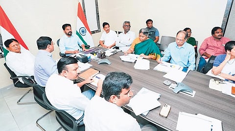 Chief Minister A Revanth Reddy reviews distribution of uniforms and other educational material on Saturday.