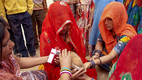 This image received on Sept. 20, 2026, shows women performing rituals at Vadia village, in Banaskantha district, Gujarat.