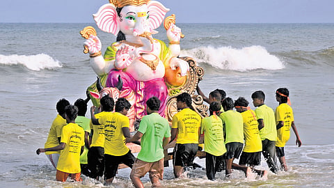 A Ganesha idol being immersed into the sea as part of the Vinayagar Chaturthi festival at Pattinapakkam on Sunday  