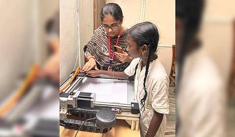 Lingampalli Himaja with ‘Rudra’, a voice-enabled Braille printing machine.
