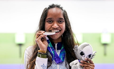Rifle shooter Elavenil Valarivan rejoices after winning the silver medal