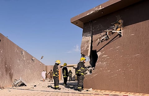 This photo provided by the Saudi Press Agency shows firefighters inspecting damage to a building caused by falling debris from a drone that Saudi authorities said was launched by Yemen's Houthi rebels and intercepted over Taif province, western Saudi Arabia, Thursday, Sept. 17, 2026.