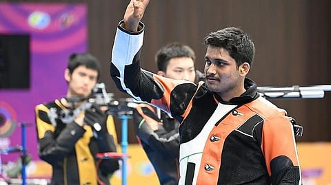 Indian shooter Rudrankksh Patil acknowledges the crowd.
