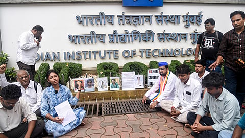 Demonstrators stage a candlelight protest to pay tribute to the suicide victims of IIT Bombay, in Mumbai, Monday, Sept. 21, 2026.