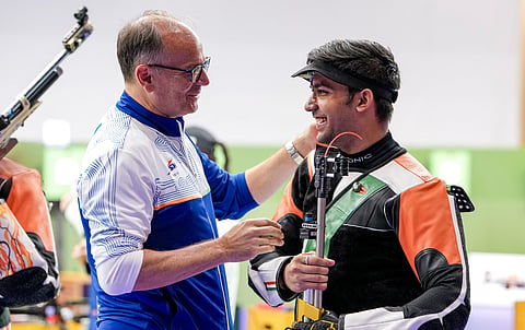 Himanshu Dhillon (R) with India rifle coach Thomas Farnik on Monday