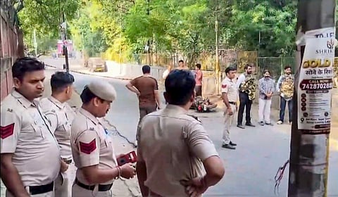 Police personnel stand at a sealed area, at a park located between Kalkaji Mandir and ISKCON Temple after a 17 year old was allegedly sexually assaulted, in New Delhi, Tuesday, September 22, 2026.