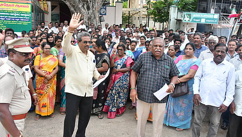 The members of the Tamil Nadu State Primary Cooperative Bank All Employees Association staged a protest near Vellore Collectorat