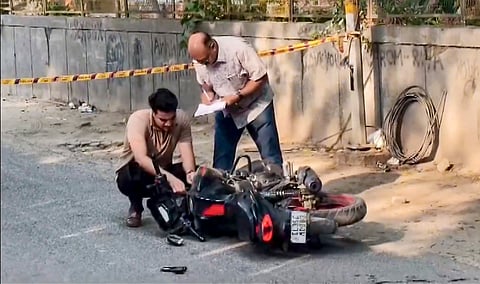 Officials examine a spot, at a park located between Kalkaji Mandir and ISKCON Temple after a 17 year old was allegedly sexually assaulted, in New Delhi, Tuesday, September 22, 2026. One of the accused was later apprehended after an exchange of fire with police.