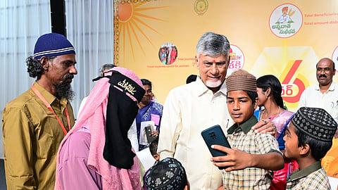 Chandrababu Naidu interacting with beneficiaries of various welfare schemes in Kuppam on Monday  