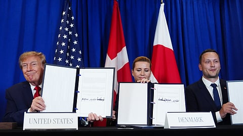 President Donald Trump signs a security agreement with Denmark's Prime Minister Mette Frederiksen and Greenland's Prime Minister Jens-Frederik Nielsen during the United Nations General Assembly, Tuesday, Sept. 22, 2026, at the UN headquarters.