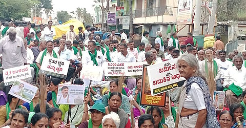 Farmers protesting against the proposed Greater Bengaluru Integrated Township project in Bidadi block the Bidadi-Harohalli Main Road on Monday 