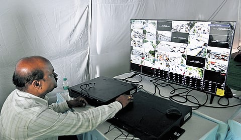A police official monitors CCTV footage of the processions at Tank Bund from the control centre in Hyderabad.