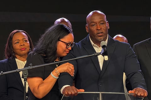 In this photo taken with a smartphone, Nolan Wells' father, Elmore Wonsley, speaks at a news conference in Stonecrest, Ga., Thursday, Sept. 22, 2026, accompanied by Wells' mother, Christine Wonsley.