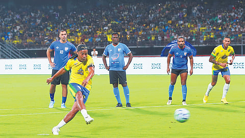 Ronaldinho converts a penalty against the Indian All Stars.