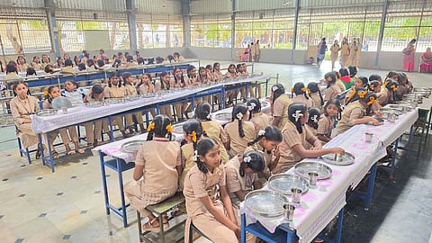  Students at Government Girls Higher Secondary in Krishnagiri are waiting for breakfast on Tuesday. 