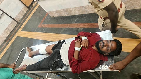 Prakash (L) who was shot in the leg by police.