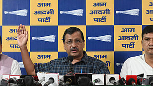 Former Delhi chief minister and Aam Aadmi Party (AAP) chief Arvind Kejriwal (C) party MP Sanjay Singh (L) and the party's Delhi chief Saurabh Bharadwaj (R).