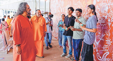 Amritanandamayi Math 
vice-chairman Swami Amritaswarupananda Puri reviewing the progress of the special venue being constructed at Amritapuri for the Viswa Seva Day celebrations
