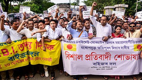 Raijor Dal MLA Akhil Gogoi and other stage a protest demanding compensation for the flood-affected people, in Guwahati, Assam, Wednesday, Sept. 23, 2026.