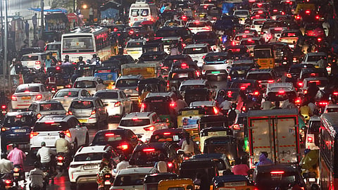 Traffic comes to a standstill amid heavy rains near Martyrs Memorial in Hyderabad on Tuesday. 