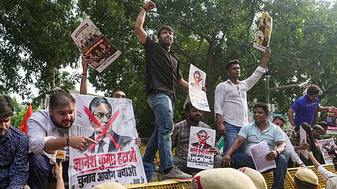 Police personnel present at the site as the Indian Youth Congress (IYC) members stage a protest against Chief Election Commissioner (CEC) Gyanesh Kumar, in New Delhi, Wednesday, Sept. 23, 2026. 