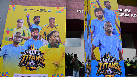 Ahead of tomorrow’s India-Brazil exhibition match, posters featuring Indian footballer I. M. Vijayan and Brazilian footballer Ronaldo were placed in front of the Jawaharlal Nehru International Stadium in Kochi.