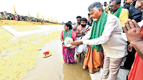 CM Nara Chandrababu Naidu performs Jala Harathi to the water of Handri-Neeva at Gundisettipalle of Kuppam constituency on Tuesday