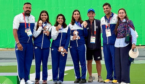 India foreign coach (skeet) Riccardo Filippelli (3rd R) with the women's skeet team