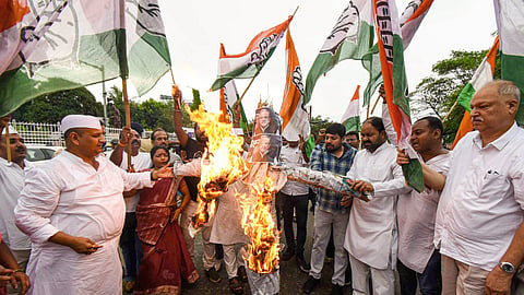 Congress party workers burn an effigy during a protest against Chief Election Commissioner Gyanesh Kumar in Patna on Wednesday, Sept. 23, 2026.