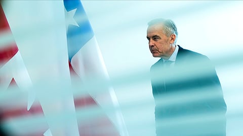 Canada Prime Minister Mark Carney is seen from behind a glass pane as he waits to meet with President of Chile José Antonio Kast, not shown, on the sidelines of the United Nations General Assembly (UNGA) at the UN headquarters on Tuesday, Sept. 22, 2026.