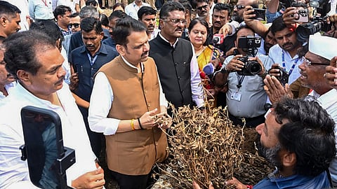 Maharashtra Chief Minister Devendra Fadnavis during an inspection of areas affected by the drought-like situation in Malkapur, Kalamb Taluka and Dharashiv district on Wednesday, Sept. 23, 2026. State Minister Pratap Sarnaik, MLA Ranajagjitsinha Patil and others are also present.