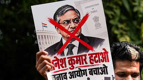  A protestor holds a poster of Chief Election Commissioner (CEC) Gyanesh Kumar during a protest by Indian Youth Congress (IYC) members against the CEC, in New Delhi, Wednesday, Sept. 23, 2026. 