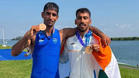 Salman Khan and Satnam Singh (R) celebrate their podium finish in Nagoya, Japan on Thursday